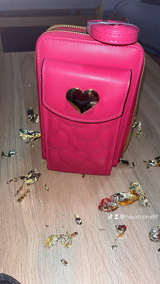 Sac rose à main femme idéal pour mettre le téléphone portefeuille